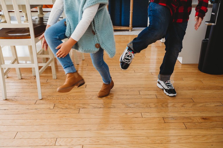 brother and sister dancing in kitchen