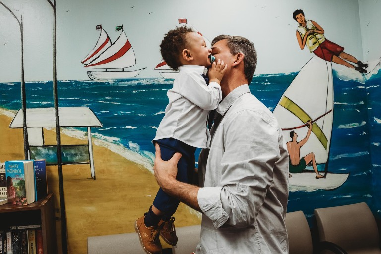 dad and baby laughing