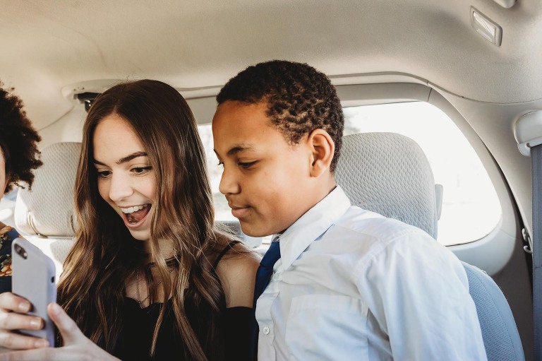 siblings taking selfies