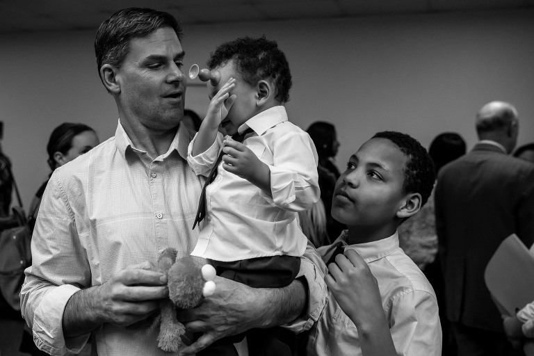 dad, baby, and brother waiting