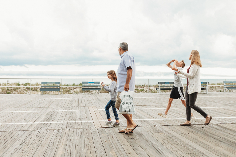 Family walking on the boardwalk in ocean city NJ