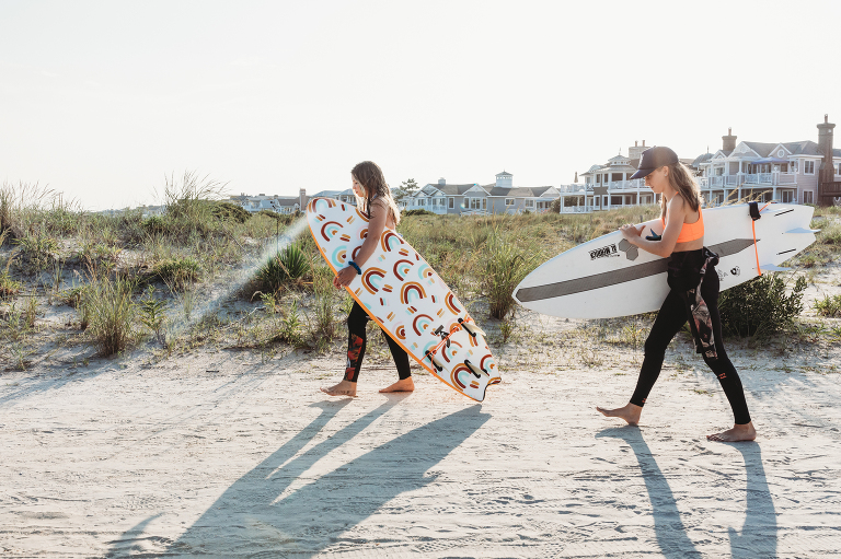 two sisters head to the beach for sunset surf session
