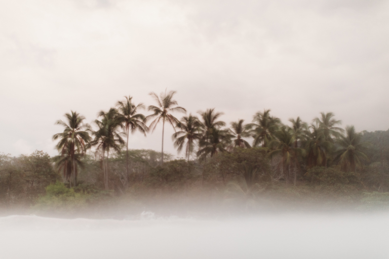 hazy view from the ocean in Playa Dominical surf photographer